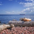 Rocky Lake Superior beach with a tanker boat