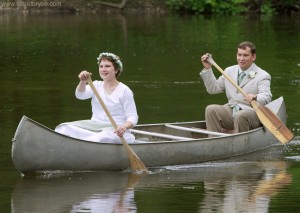 Arriving at our reception in an aluminum canoe