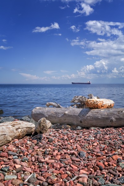 Rocky Lake Superior beach with a tanker boat